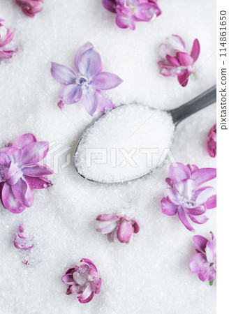 Bowl of Sugar With Lilac Blossoms on a Textured Background 114861650