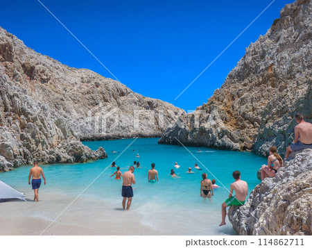 Secluded beach surrounded by cliffs (Seitan Limaniya, Crete, Greece) Secluded beach surrounded by cliffs (Seitan Limaniya, Crete, Greece) 114862711