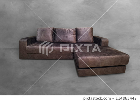Modern convertible sofa isolated on cement background 114863442