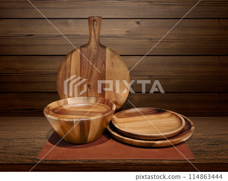 Wooden crockery. Wooden pizza tray in the kitchen on wooden table background. 114863444