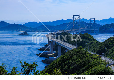 Naruto Strait as seen from the temporary store at Roadside Station Usushio. Onaruto Bridge connecting Awaji Island and Shikoku. 114863494