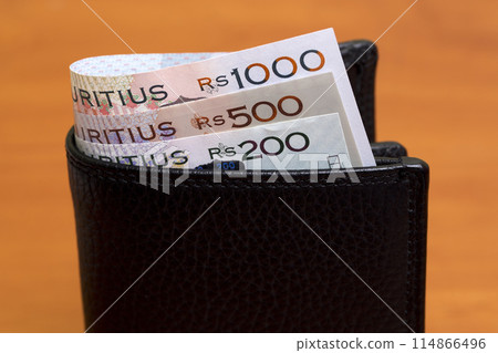 Mauritian rupee in the black wallet 114866496