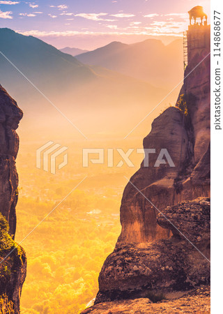 Sunset over Varlaam monastery in Meteora, Greece 114868677