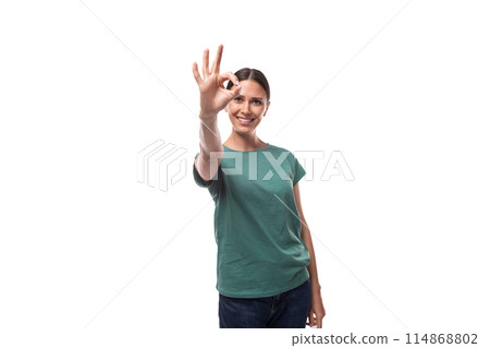 young brunette woman in love with collected hair is dressed in a basic t-shirt and jeans 114868802