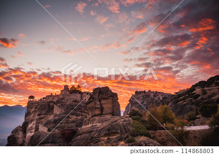 Sunset over Varlaam monastery in Meteora, Greece 114868803