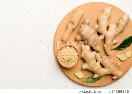 ginger on Cutting board table, top view. Space for text ginger on Cutting board table, top view. Space for text 114869326