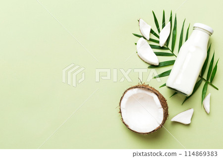 coconut products on white wooden table background. Dairy free milk substitute drink, Flat lay healthy eating coconut products on white wooden table background. Dairy free milk substitute drink, Flat lay healthy eating 114869383