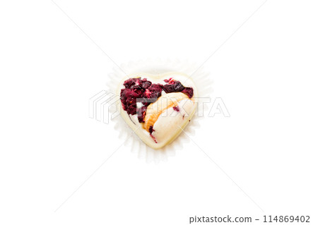 top view of chocolate pralines in heart form isolated on white background 114869402
