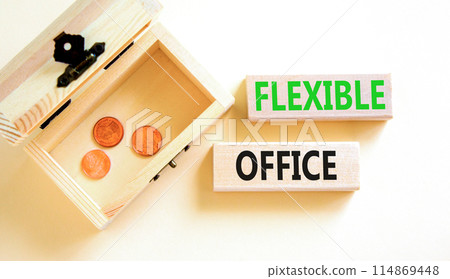 Flexible office symbol. Concept words Flexible office on beautiful wooden block. Beautiful white paper background. Wooden chest with coins. Business Flexible office concept. Copy space. Flexible office symbol. Concept words Flexible office on beautiful wooden block. Beautiful white paper background. Wooden chest with coins. Business Flexible office concept. Copy space. 114869448