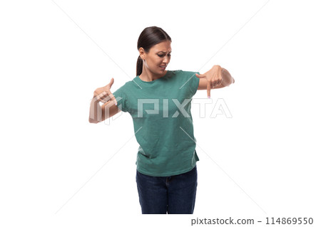 charming cute friendly slender young brunette woman dressed in a green t-shirt attracts attention 114869550