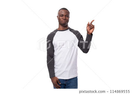 young stylish confident american man dressed casually in a black and white sweatshirt points his young stylish confident american man dressed casually in a black and white sweatshirt points his 114869555