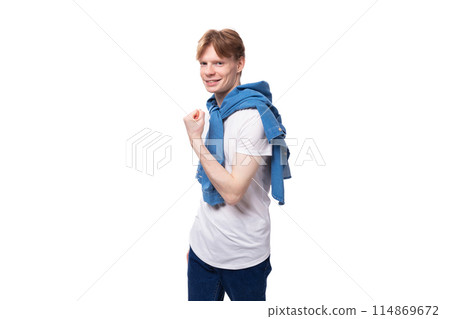 young well-groomed cute caucasian male student with golden red hair with a tattoo on his arms is young well-groomed cute caucasian male student with golden red hair with a tattoo on his arms is 114869672