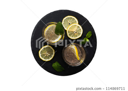 Healthy breakfast or morning with chia seeds lemon and mint on table background, vegetarian food, diet and health concept. Chia pudding with lemon and mint 114869711