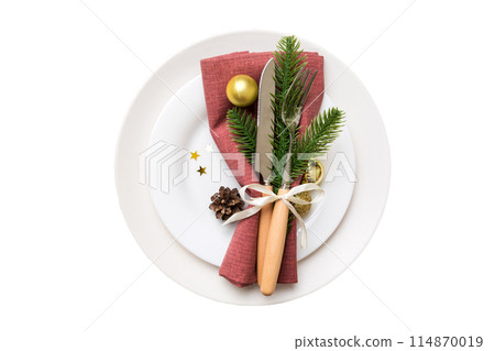 isolated christmas Plate with decor and fork and spoon. New year holiday background. Top view 114870019