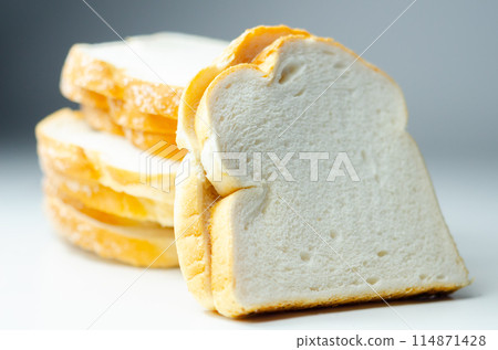 White toast cut into slices, freshly baked for breakfast, soft bread 114871428