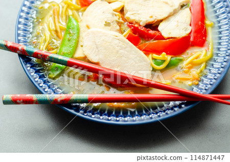Chicken broth with ginger and black fungus mushrooms, high protein wheat noodles, sliced steamed chicken breast, julienne carrot 114871447