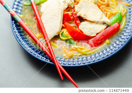 Chicken broth with ginger and black fungus mushrooms, high protein wheat noodles, sliced steamed chicken breast, julienne carrot 114871449