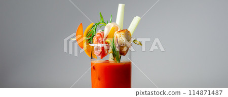A glass of Bloody Mary drink with a celery spear and an orange slice on top A glass of Bloody Mary drink with a celery spear and an orange slice on top 114871487