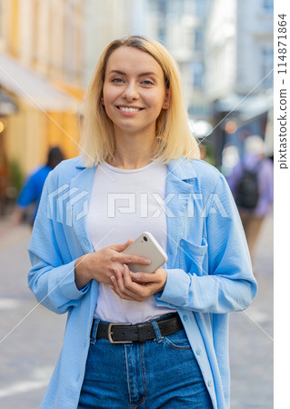 Tourist traveler young woman using smartphone typing text messages looking for search a way on map 114871864