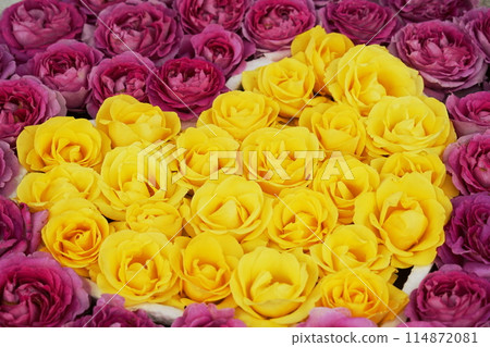 Yellow rose flower heart symbol 114872081