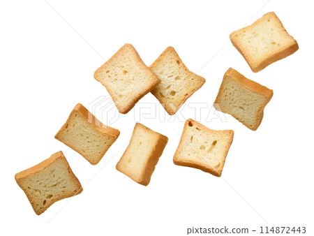 Croutons bread flying close-up on a white. Isolated 114872443