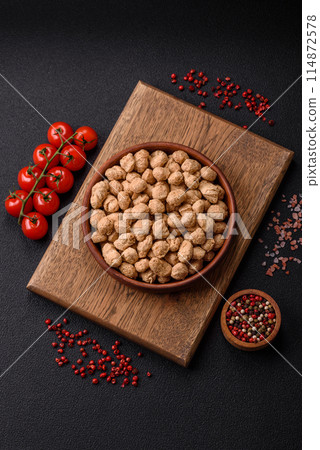Dry soybean meat pellets, diet food for vegan and vegetarian cuisine Dry soybean meat pellets, diet food for vegan and vegetarian cuisine 114872578