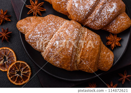 Delicious crispy golden croissant with chocolate filling Delicious crispy golden croissant with chocolate filling 114872621