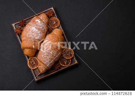 Delicious crispy golden croissant with chocolate filling 114872628