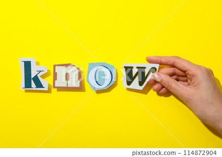 The word is laid out from letters on a yellow background. 114872904