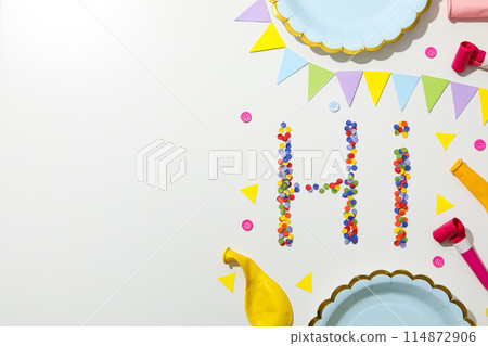 The word "hi" is made of colored plasticine on a white background. 114872906