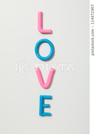 The word "love" is made of colored plasticine on a white background. 114872907