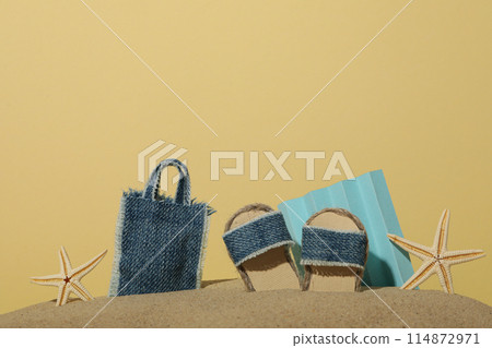 Miniature summer things for relaxing on the beach, near the sea. Miniature summer things for relaxing on the beach, near the sea. 114872971