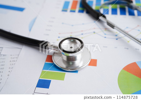 Stethoscope and US dollar banknotes on chart or graph paper, Financial, account, statistics and business data medical health concept. Stethoscope and US dollar banknotes on chart or graph paper, Financial, account, statistics and business data medical health concept. 114875728