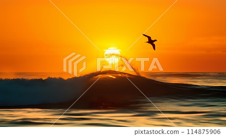 The sun rises over the ocean, casting a golden glow on the wave 114875906