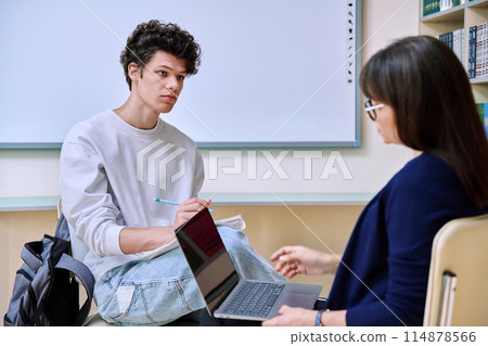 Guy college student talking studying with female teacher 114878566