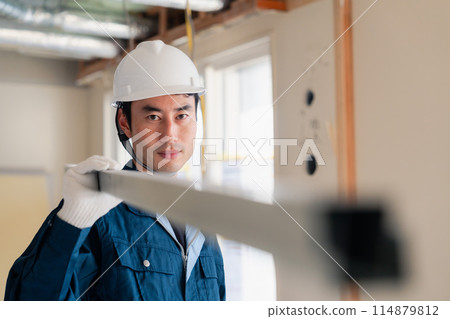 Carpenters bringing materials to the site Carpenters bringing materials to the site 114879812