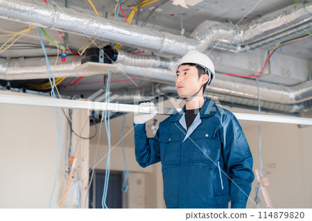Carpenters bringing materials to the site Carpenters bringing materials to the site 114879820