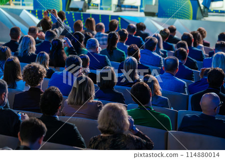Diverse audience attentively listening at a business conference Diverse audience attentively listening at a business conference 114880014
