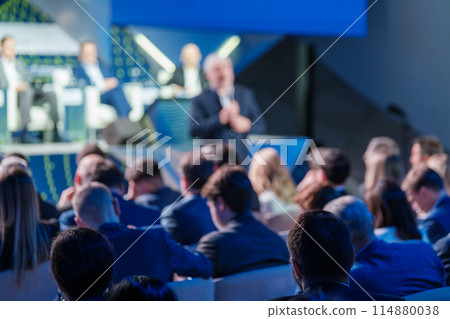 Business conference with a speaker addressing an audience Business conference with a speaker addressing an audience 114880038