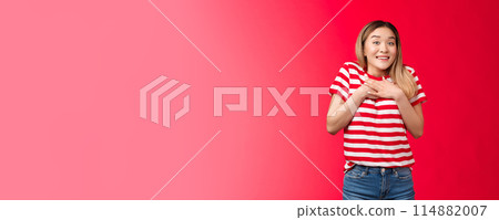 Impressed tender asian silly blond girl amazed describe fascinating performance, woman press palms chest smiling speechless adore cool gift, feed grateful and appreciation, stand red background Impressed tender asian silly blond girl amazed describe fascinating performance, woman press palms chest smiling speechless adore cool gift, feed grateful and appreciation, stand red background 114882007