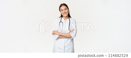 Asian female doctor, physician in medical uniform with stethoscope, cross arms on chest, smiling and looking like professional, white background Asian female doctor, physician in medical uniform with stethoscope, cross arms on chest, smiling and looking like professional, white background 114882529