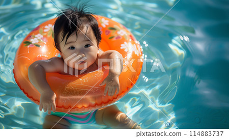 Baby playing in the pool 114883737
