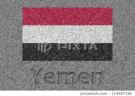 The Yemeni flag painted on a stone slab with the word "Yemen" carved into it 114887190