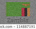 The Zambian flag painted on a stone slab with the word "Zambia" carved into it 114887191
