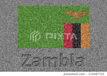 The Zambian flag painted on a stone slab with the word "Zambia" carved into it 114887191