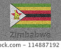The Zimbabwean flag painted on a stone slab with the word "Zimbabwe" carved into it 114887192