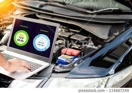 A person is working on a laptop that has a green circle with the number 60 on it A person is working on a laptop that has a green circle with the number 60 on it 114887249