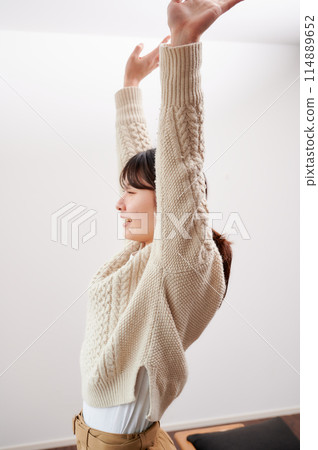 Woman stretching in the morning Woman stretching in the morning 114889652