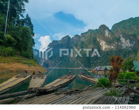 Bamboo rafts moored at a dock on a lake (Khao Sok, Surat Thani Province, Thailand) Bamboo rafts moored at a dock on a lake (Khao Sok, Surat Thani Province, Thailand) 114892960