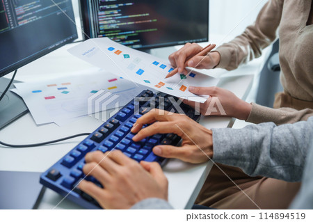 asian and Indian Developer team discussion feedback analysis coding data with software computer at office 114894519
